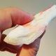 Closeup of surimi flake, approximately two inches across